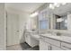 Bathroom featuring double sinks with white cabinets and quartz countertop at 16057 Coleman Dr, Westfield, IN 46074