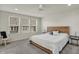 Serene bedroom with large windows, a ceiling fan, and modern decor at 16057 Coleman Dr, Westfield, IN 46074