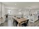 Open dining and kitchen area with hardwood floors and view of the staircase and second floor railing at 16057 Coleman Dr, Westfield, IN 46074