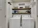 Well-organized laundry room with shelving and storage, washer, and dryer for convenience at 16057 Coleman Dr, Westfield, IN 46074