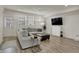 Cozy living room filled with natural light, plush seating, and modern decor elements at 16057 Coleman Dr, Westfield, IN 46074
