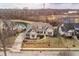 Stunning aerial view of a beautifully landscaped home with manicured lawns and a serene pond, showcasing curb appeal at 16882 Oak Manor Dr, Westfield, IN 46074