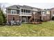 Spacious backyard with a fire pit area, hot tub, and patio, great for outdoor gatherings and relaxation at 16882 Oak Manor Dr, Westfield, IN 46074