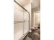A minimalist shower room featuring slate floors, a frosted glass shower and a simple door frame at 16882 Oak Manor Dr, Westfield, IN 46074
