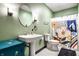 Charming bathroom with decorative mirror, classic fixtures, and a colorful shower curtain adding personality at 16882 Oak Manor Dr, Westfield, IN 46074