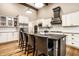 Modern kitchen with stainless steel appliances, granite countertops, white cabinets and a spacious center island at 16882 Oak Manor Dr, Westfield, IN 46074