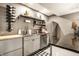 Basement kitchenette featuring stainless steel appliances, sleek cabinets, and granite countertops for added convenience at 16882 Oak Manor Dr, Westfield, IN 46074