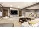 Comfortable living room featuring a big screen TV, a large sectional couch, and ample lighting fixtures at 16882 Oak Manor Dr, Westfield, IN 46074