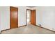 Bedroom featuring neutral carpeting and a closet with paneled wooden doors at 1901 E Edgewood Ave, Indianapolis, IN 46227