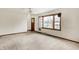 Bright living room with large windows and neutral carpet, perfect for relaxation at 1901 E Edgewood Ave, Indianapolis, IN 46227