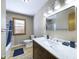 Bathroom featuring new marble tile and modern vanity at 2021 E 9Th St, Anderson, IN 46012