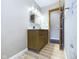 Bathroom with a wooden vanity and a new wooden vinyl floor at 2021 E 9Th St, Anderson, IN 46012