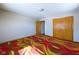 A spacious bedroom featuring a unique carpet, and a closet at 2021 E 9Th St, Anderson, IN 46012