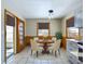 Cozy breakfast nook with round table, warm lighting, and view to outside at 2021 E 9Th St, Anderson, IN 46012