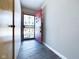 The entrance foyer features slate flooring and a sturdy security door at 2021 E 9Th St, Anderson, IN 46012