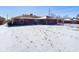 Charming single story home with attached garage and snow covered lawn at 2021 E 9Th St, Anderson, IN 46012