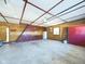 Large garage with ample space for vehicles and storage, offering practicality and convenience at 2021 E 9Th St, Anderson, IN 46012