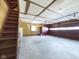 Spacious garage with high ceilings and a workshop area, perfect for projects and storage at 2021 E 9Th St, Anderson, IN 46012