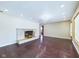 Open living room featuring a stone fireplace, wood floors and bright recessed lighting at 2021 E 9Th St, Anderson, IN 46012