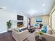 Bright living room featuring a fireplace, neutral-toned furniture, and modern decor at 2021 E 9Th St, Anderson, IN 46012