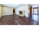 Spacious living room with wood flooring, a stone fireplace and a chandelier at 2021 E 9Th St, Anderson, IN 46012