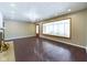 Light-filled living room featuring recessed lights, wood flooring and a modern window at 2021 E 9Th St, Anderson, IN 46012