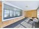 Bright sunroom with brick walls, large windows and carpet at 2021 E 9Th St, Anderson, IN 46012