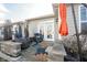 Charming back patio featuring cozy seating and an orange umbrella, ideal for outdoor enjoyment and relaxing at 208 Coatsville Dr, Westfield, IN 46074