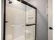 This bathroom features a glass-enclosed shower with a built-in seat at 208 Coatsville Dr, Westfield, IN 46074