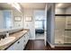 The bathroom features dual sinks, ample counter space, a glass-enclosed shower and bedroom access at 208 Coatsville Dr, Westfield, IN 46074