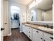 Clean, spacious bathroom featuring a double sink vanity, tile floors, and a large walk-in closet at 208 Coatsville Dr, Westfield, IN 46074