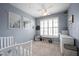 Cozy bedroom with a ceiling fan, window with shutters, and playful decor at 208 Coatsville Dr, Westfield, IN 46074