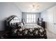 Comfortable bedroom with neutral walls, a ceiling fan, window with shutters, and a queen-sized bed at 208 Coatsville Dr, Westfield, IN 46074