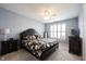 Cozy bedroom with a queen-sized bed, a ceiling fan, and neutral color palette at 208 Coatsville Dr, Westfield, IN 46074