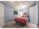 This bedroom has natural light, light blue walls, and a ceiling fan at 208 Coatsville Dr, Westfield, IN 46074
