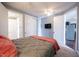 Comfortable bedroom offering a ceiling fan, closet, and connected bathroom at 208 Coatsville Dr, Westfield, IN 46074