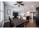 Open-concept dining room with view to kitchen, living room, dark hardwood floors, and neutral-colored walls at 208 Coatsville Dr, Westfield, IN 46074