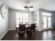 Charming dining room with a ceiling fan, large window, and elegant table set with chairs at 208 Coatsville Dr, Westfield, IN 46074
