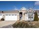 Charming home exterior featuring a stone facade, arched entryway, and well-manicured lawn at 208 Coatsville Dr, Westfield, IN 46074