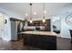 Well-equipped kitchen features stainless steel appliances, a breakfast bar island, and dark cabinetry at 208 Coatsville Dr, Westfield, IN 46074