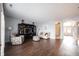 Spacious living room featuring wood flooring, ample seating, and an entertainment center at 208 Coatsville Dr, Westfield, IN 46074