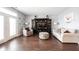 Cozy living room featuring modern furniture, an entertainment center and wood flooring at 208 Coatsville Dr, Westfield, IN 46074