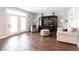 Bright living room with wood floors, a media center, comfortable seating, and a patio door at 208 Coatsville Dr, Westfield, IN 46074