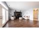 Open-concept living room with wood floors, natural light, and an entertainment center at 208 Coatsville Dr, Westfield, IN 46074