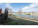 Tranquil pond view framed by mature trees, complementing the serene outdoor atmosphere of this inviting property at 208 Coatsville Dr, Westfield, IN 46074