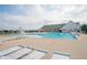 Community pool area featuring sun loungers, lifeguard stand, and a spacious pool for residents to enjoy at 208 Coatsville Dr, Westfield, IN 46074