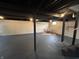A finished basement offers a blank canvas and features painted floors, and exposed beams at 220 Huffman Rd, Columbus, IN 47201