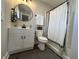 Modern bathroom with updated vanity, black fixtures, and shower-tub combination at 220 Huffman Rd, Columbus, IN 47201