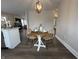 Eat-in dining room featuring modern decor and open to living area at 220 Huffman Rd, Columbus, IN 47201