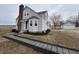 Charming two-story home with a brick chimney and a landscaped yard at 220 Huffman Rd, Columbus, IN 47201